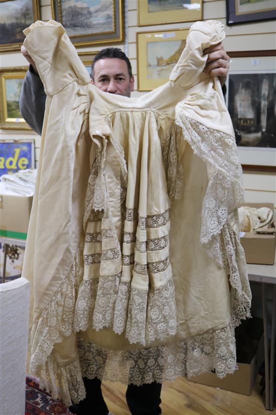 Two ornate babys 19th century christening capes, a silk and lace wedding train, waxed headdress and veil